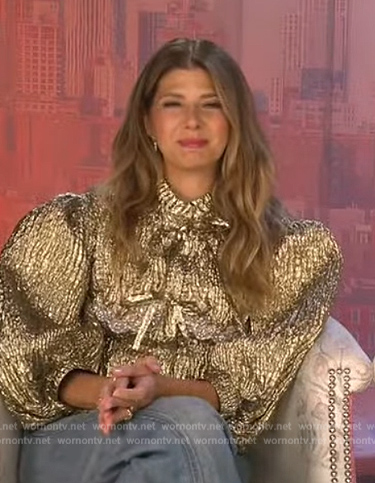 Marisa Tomei’s gold metallic bow jacket on Extra