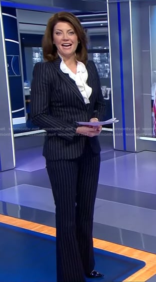 Norah’s navy pinstripe suit on CBS Evening News