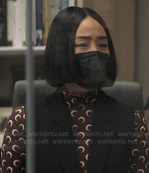Stella’s black moon print top on The Morning Show