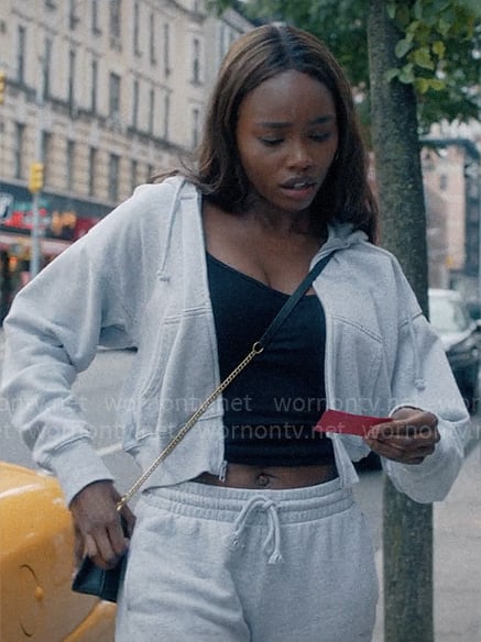 Vivian’s grey sweatshirt and Coach logo bag on American Horror Stories