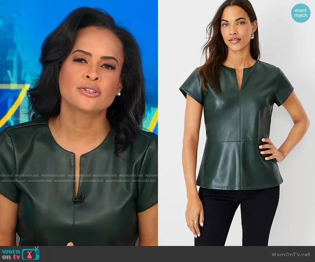 Ann Taylor Faux Leather Seamed Split Neck Peplum Top in Boxwood Green worn by Linsey Davis on Good Morning America