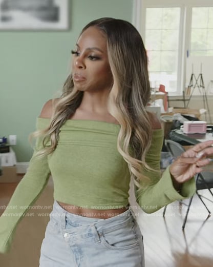 Candiace’s green off shoulder sweater and jeans on The Real Housewives of Potomac