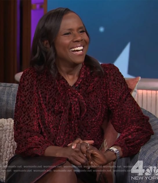 Deborah Roberts’ red sheer tie neck blouse on The Kelly Clarkson Show