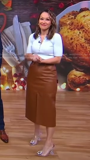Eva’s light blue polo and brown leather skirt on Good Morning America