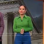 Eva’s green long sleeve polo and blue pants on Good Morning America