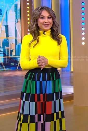 Ginger’s yellow turtleneck top and geometric skirt on Good Morning America