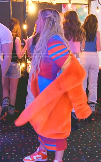 Heather’s multicolor printed dress and orange fur coat on The Real Housewives of Salt Lake City