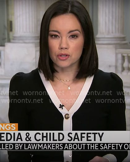 Jo Ling Kent’s black cardigan with white trim on CBS Mornings
