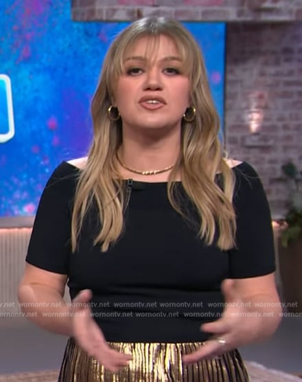 Kelly’s black off shoulder top and metallic skirt on The Kelly Clarkson Show