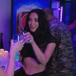 Kim’s black sheer ribbed top and skirt on The Kardashians