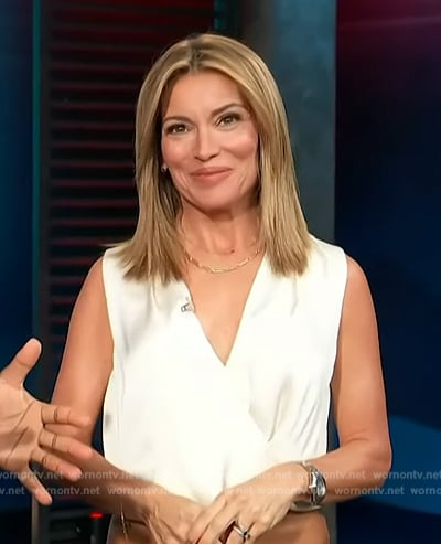 Kit’s white sleeveless wrap top on Access Hollywood
