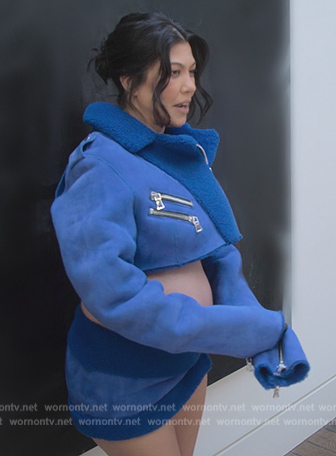 Kourtney’s blue shearling trim cropped jacket and skirt on The Kardashians