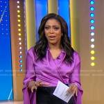 Morgan Norwood’s purple satin draped wrap blouse on Good Morning America