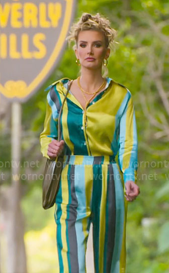 Nicole’s blue and lime green striped blouse and pants set on Selling Sunset