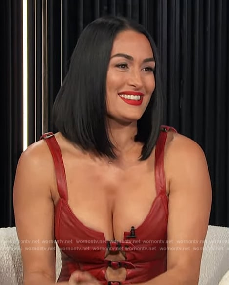 Nikki Garcia’s red buckle strap top on E! News