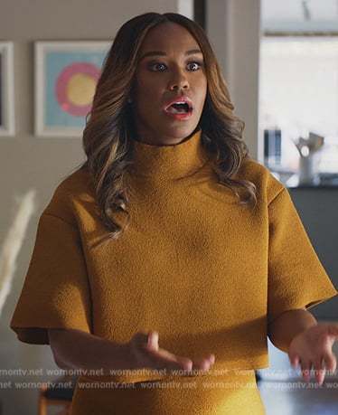 Rachel’s mustard textured high neck top on All Rise
