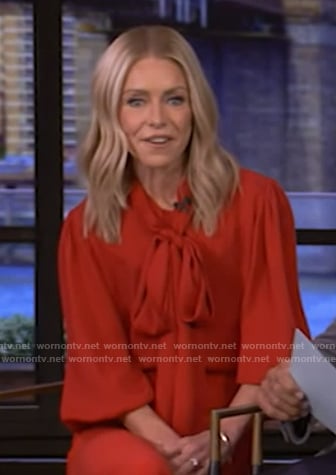 Kelly’s red tie neck blouse on Live with Kelly and Mark
