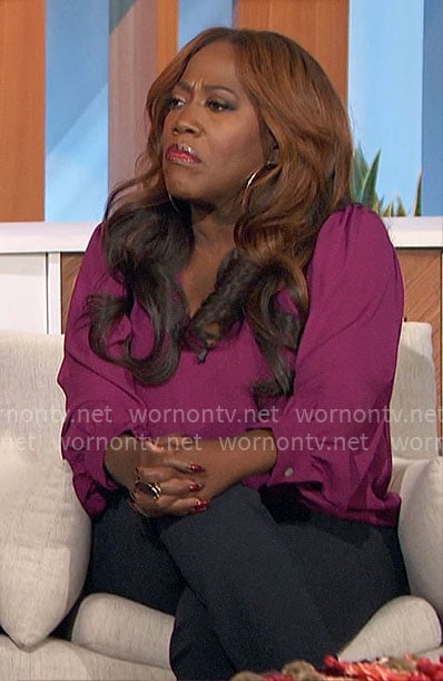 Sheryl’s magenta v-neck top on The Talk
