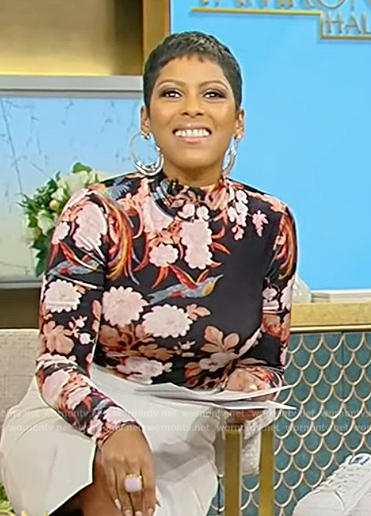 Tamron’s black floral print turtleneck top on Tamron Hall Show