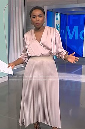 Zinhle’s pink satin wrap blouse and pleated skirt on NBC News Daily