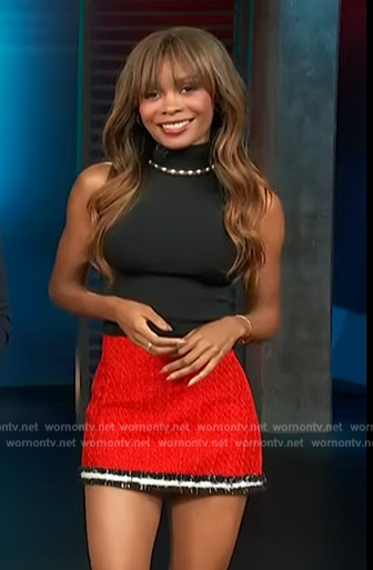 Zuri’s black pearl embellished top and tweed mini skirt on Access Hollywood
