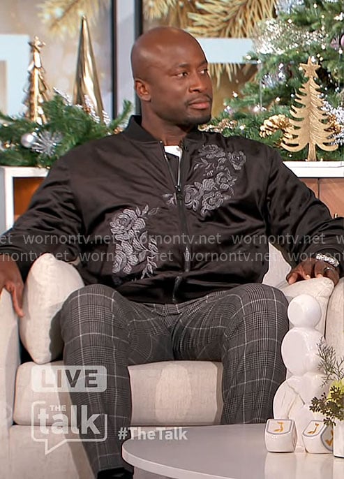 Akbar’s black floral embroidered bomber jacket on The Talk