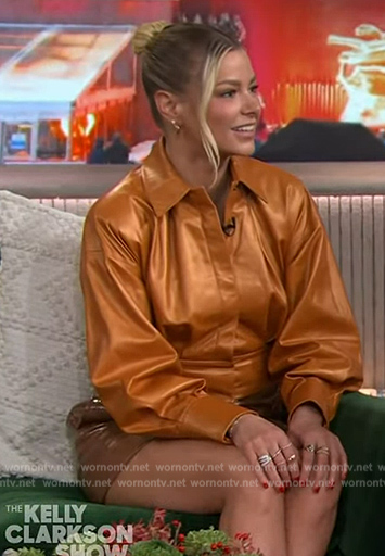 Ariana’s brown leather mini skirt and orange shirt on The Kelly Clarkson Show