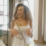 Ashley’s white ruffle mini dress on The Real Housewives of Potomac