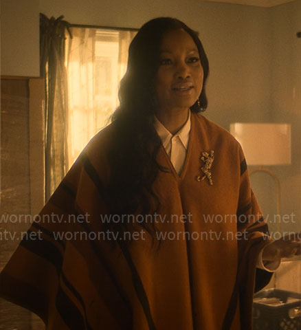 Diana’s orange striped poncho on The Other Black Girl