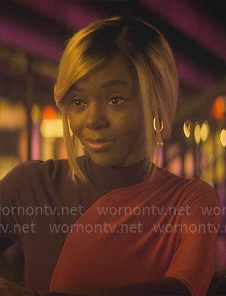Hazel’s purple and red colorblock top on The Other Black Girl