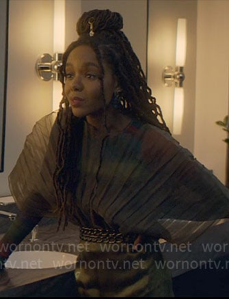 Hazel’s sheer olive pleated top on The Other Black Girl