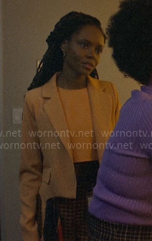 Hazel’s peach cropped blazer and check pants on The Other Black Girl