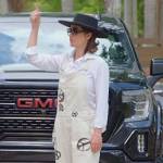 Julia’s white denim peace print overalls on The Real Housewives of Miami