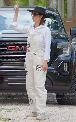 Julia’s white denim peace print overalls on The Real Housewives of Miami