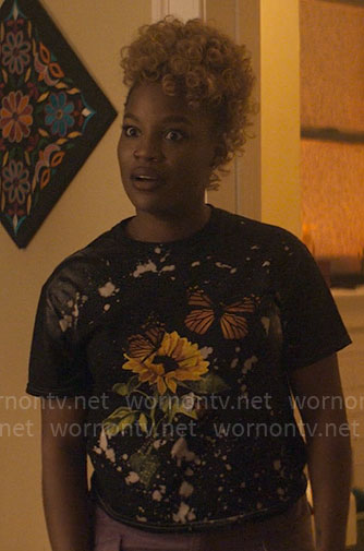 Malaika’s butterfly graphic t-shirt on The Other Black Girl