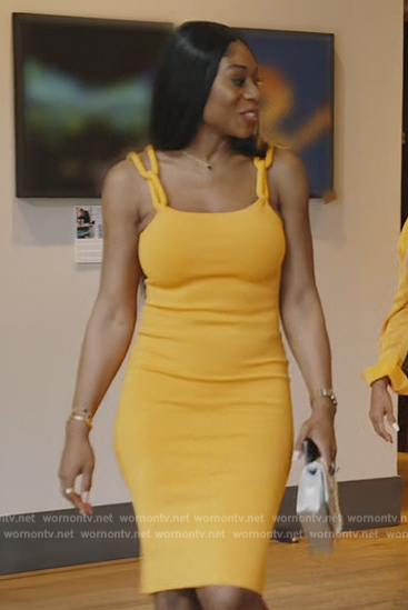Nneka’s orange chain strap dress on The Real Housewives of Potomac