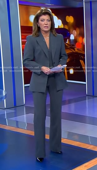 Norah’s grey pant suit on CBS Evening News