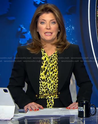 Norah’s yellow leopard blouse and black chain embellished blazer on CBS Evening News
