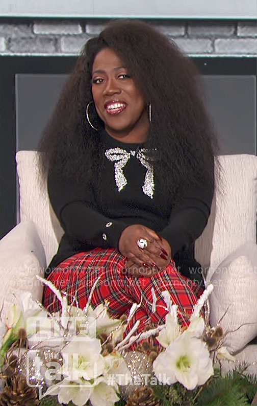 Sheryl’s black bow sweater and plaid pants on The Talk