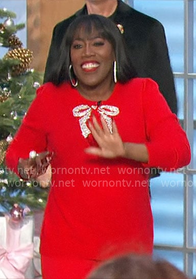 Sheryl’s red embellished bow sweater on The Talk
