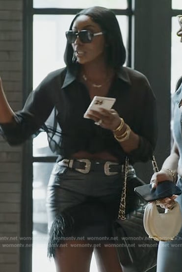 Wendy’s black leather feather trim mini skirt on The Real Housewives of Potomac