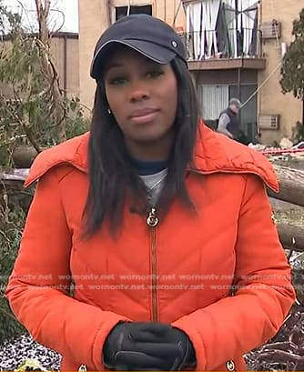 Adrienne Broaddus’s orange down coat on NBC News Daily