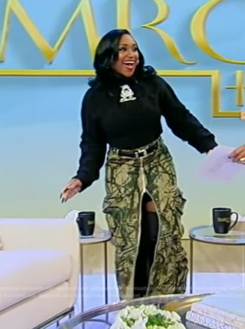 Bethany Gaskin’s green printed skirt and sweater on Tamron Hall Show