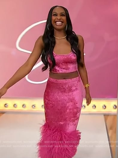 Coco Jones’s pink velvet feather trim skirt and top on Sherri