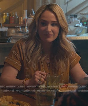 Davia’s mustard printed v-neck top on Good Trouble