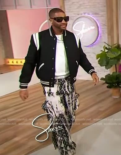 Devale Ellis’s black varsity jacket and printed pants on Sherri