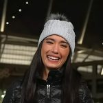 Emilie’s black quilted jacket and blue beanie on Today