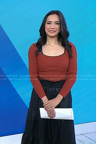 Emilie’s orange square neck top and black skirt on Today