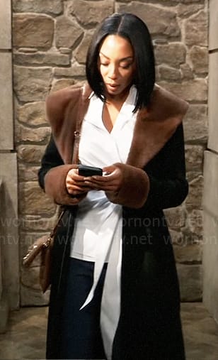 Jordan’s black zip up coat with brown fur collar on General Hospital