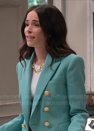 Julia’s aqua green blazer with gold buttons on Extended Family
